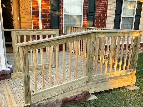 New wood deck with railings and a ramp