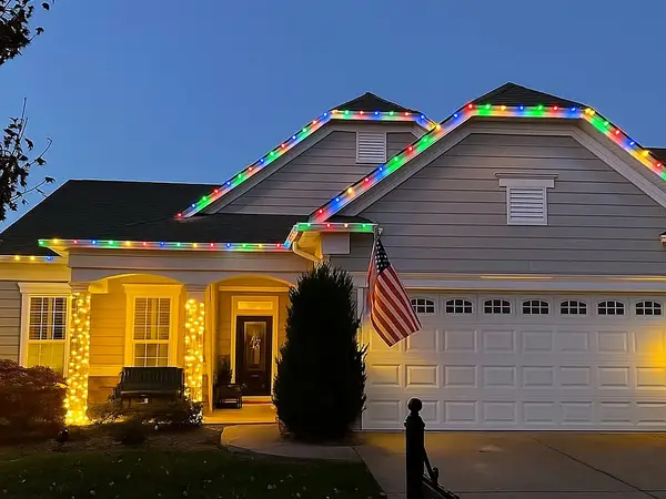 House in Mt. Juliet with multi-color holiday lights along the roof
